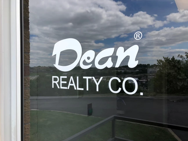 White Cut Vinyl door decal for Dean Realty Company in Kansas City, Missouri