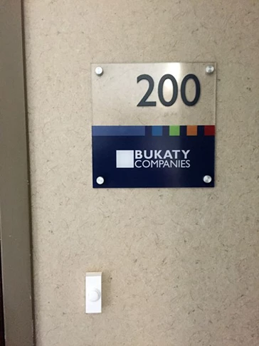 ADA Sign with Standoffs for Bukaty Companies in Leawood, Kansas