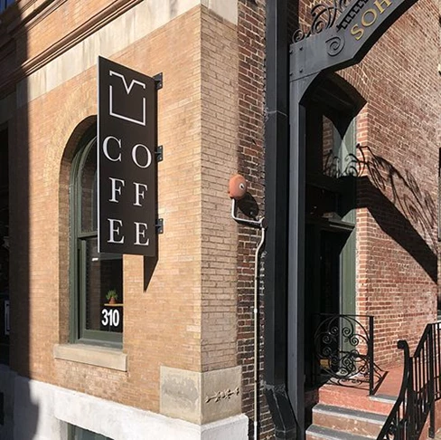 Exterior Metal Blade Sign for Vested Coffee in Kansas City, Missouri