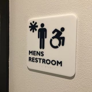 Interior ADA Restroom Sign for Medical Positioning Inc. in Kansas City, Kansas