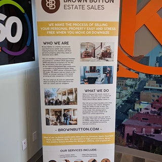 Retractable Banner Stand for Brown Button Estate Sales in Kansas City, Missouri